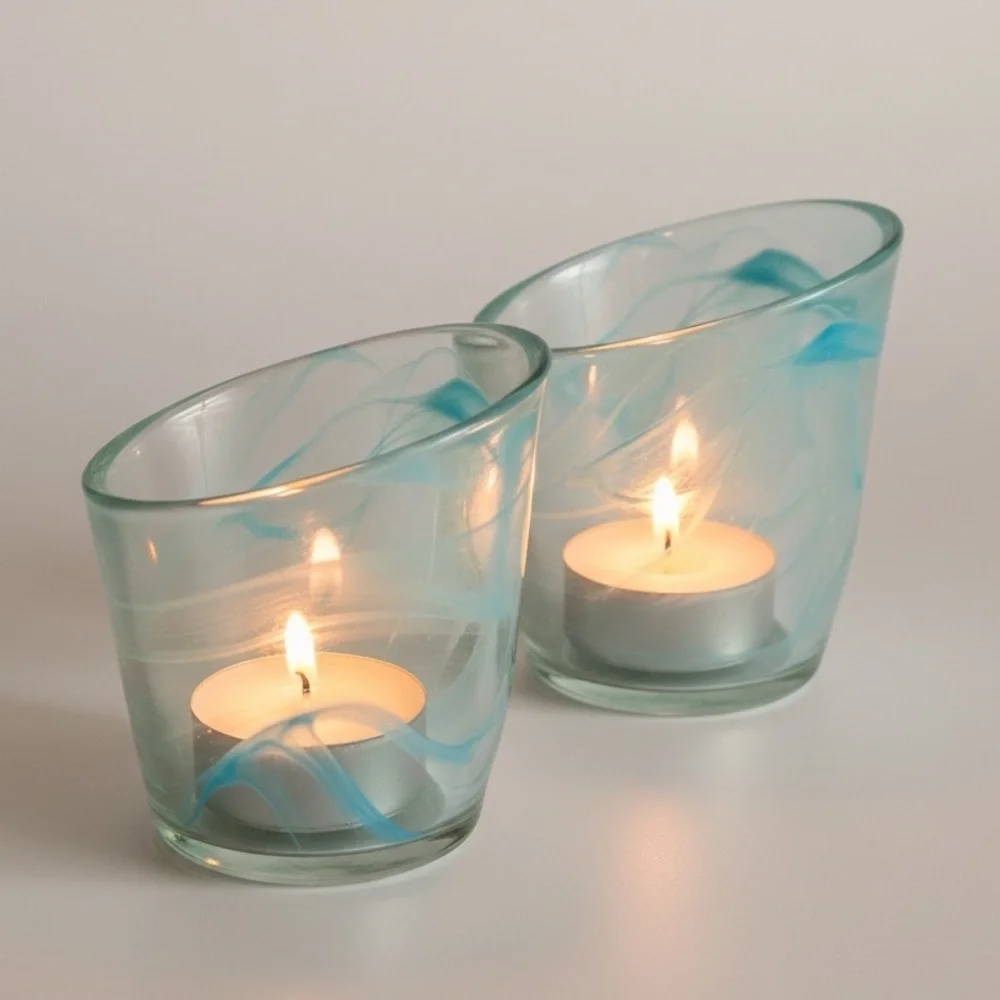 Blue swirl tea light holders with asymmetrical edges, unsigned